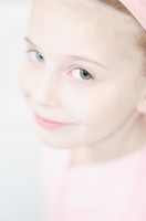 Little ballet dancer portrait Portrait of a fair-haired young ballet dancer in pink leoard and headband