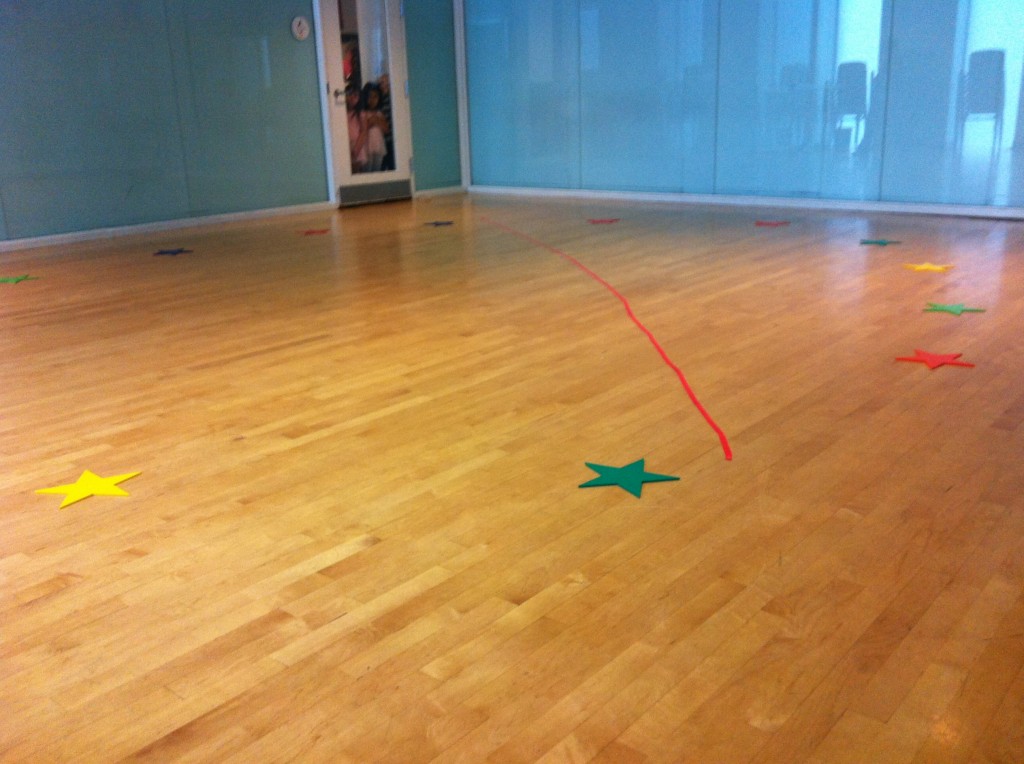 An empty dance studio with little movers waiting at the door