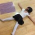 A young dancer flat on the floor like her scarf.