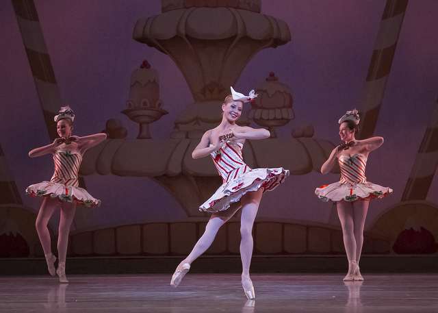 Ballerina in peppermint-striped tutu dancing in Nutcracker