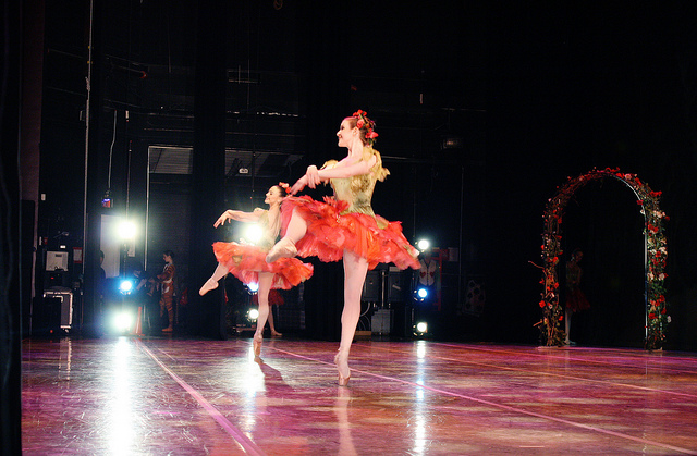 Ballet dancers in floral costumes onstage