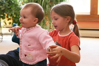 Sister helping baby dance - Quinn Dombrowski