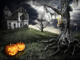 Mystical tree on the background of an abandoned house with orange pumpkins
