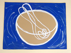 IMAGE A ceramic still-life painting featuring a mixing bowl and spoon. IMAGE