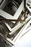 IMAGE A pile of empty, wooden frames. IMAGE