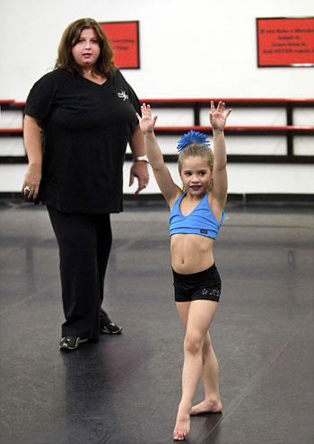 IMAGE Abby Lee Miller of Dance Moms with a student IMAGE