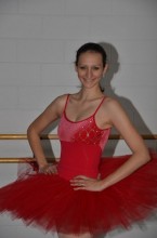 A candid photo of Alexandra in a red tutu.