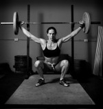 Strong woman lifting weights