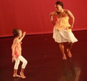 Contributor, Leila Anglin dancing with a young performer