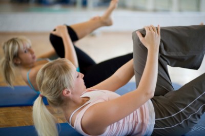 Women practicing pilates