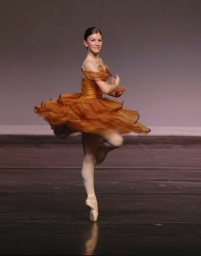 A ballet dancer performs a pirouette