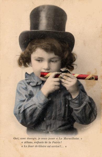 A child playing a mirliton