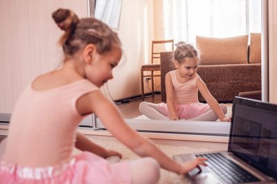 Young dancer sitting at a computer