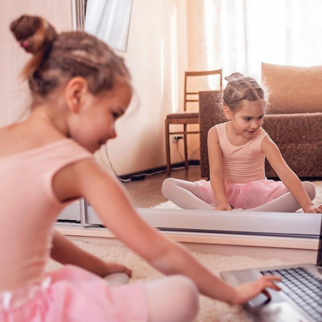 Young dancer sitting at a computer